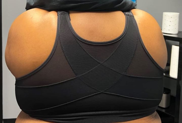Observing how wide and stretchable the bra for back fat