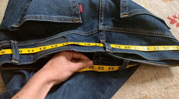 Measuring the size of the jeans for beer belly