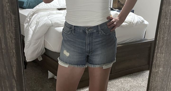 Wearing Retro High Rise Distressed Denim Short from the brand Wrangler