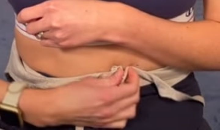 Checking out how easy to pull on and off the hook and eyelets of the bra